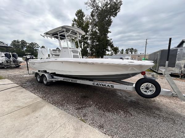 Caymas 26 HB 2024 Caymas 26 HB boat on trailer, parked outdoors, overcast sky.