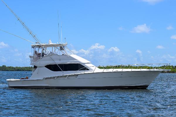 Hatteras 60 Convertible 2001 Hatteras 60 Convertible yacht on calm water under blue sky.