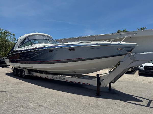 Formula 400 Super Sport 2017 Formula 400 Super Sport boat on trailer under clear blue sky.