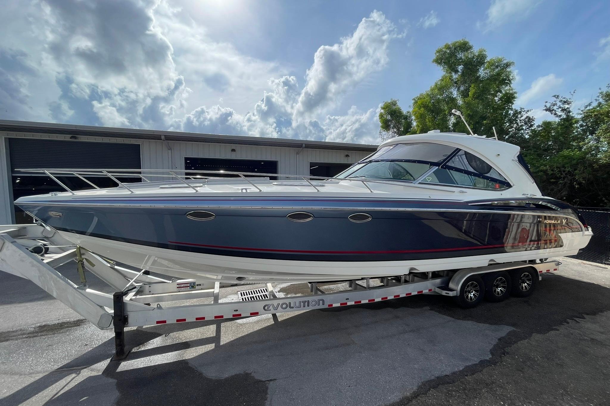 Formula 400 Super Sport 2017 Formula 400 Super Sport boat on trailer under cloudy sky.