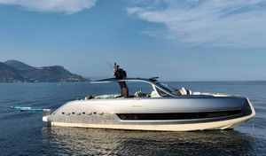 Invictus TT460 2023 Invictus TT460 yacht on calm sea with scenic mountain backdrop.