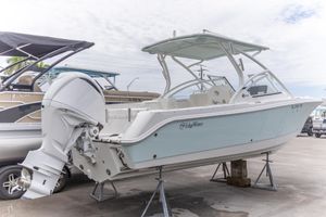 Edgewater 248CX Crossover 2023 Edgewater 248 CX boat on display, featuring sleek design and powerful outboard motor.