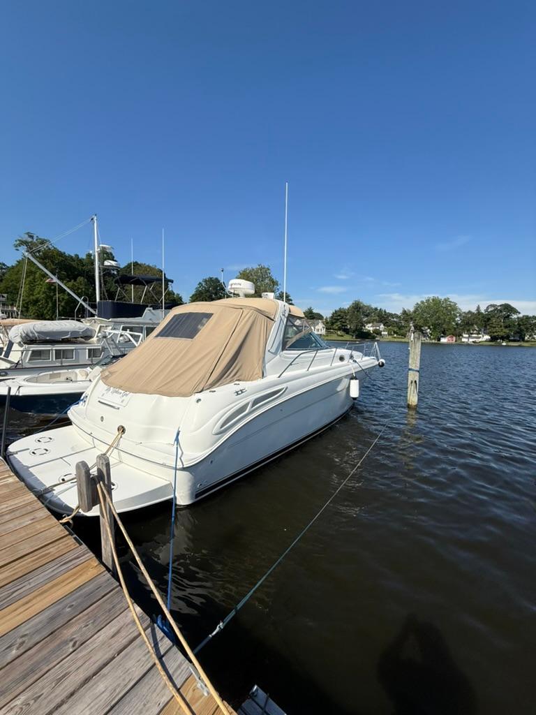 Sea Ray 380 Sundancer 2000 Sea Ray 380 Sundancer docked at a marina under clear blue skies.