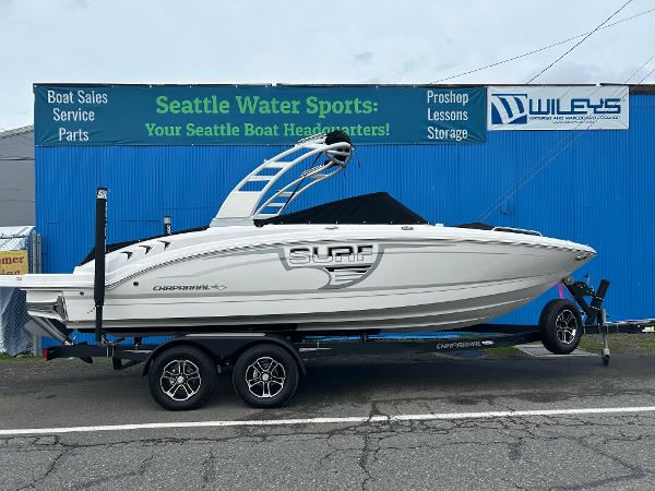Chaparral 23 Surf 2024 Chaparral 23 Surf boat on trailer at Seattle Water Sports dealership.
