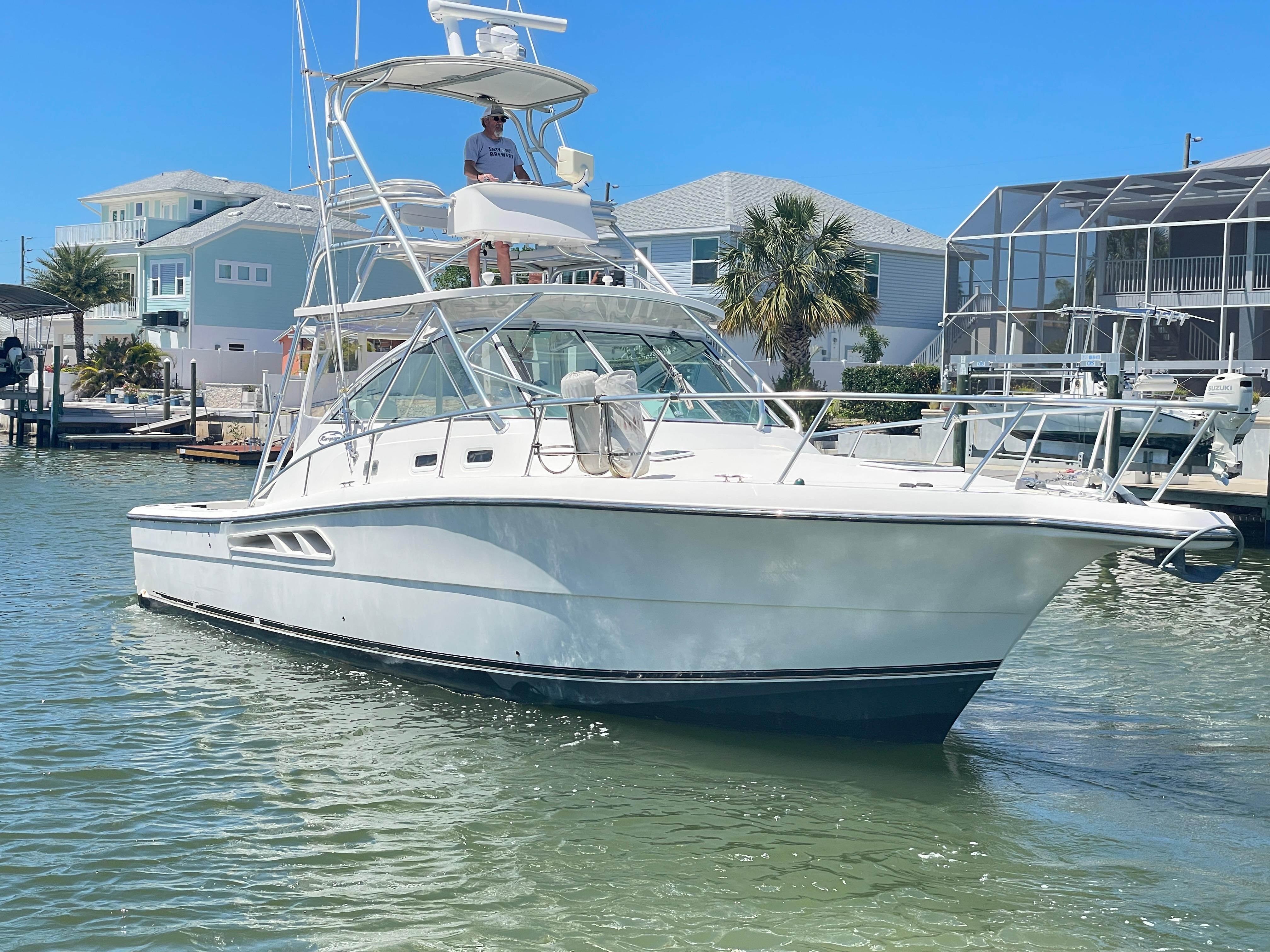 Rampage 38 Express 2007 Rampage 38 Express boat docked in a sunny marina.