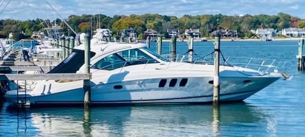 Sea Ray 48 Sundancer 2008 Sea Ray 48 Sundancer yacht docked in a scenic marina.