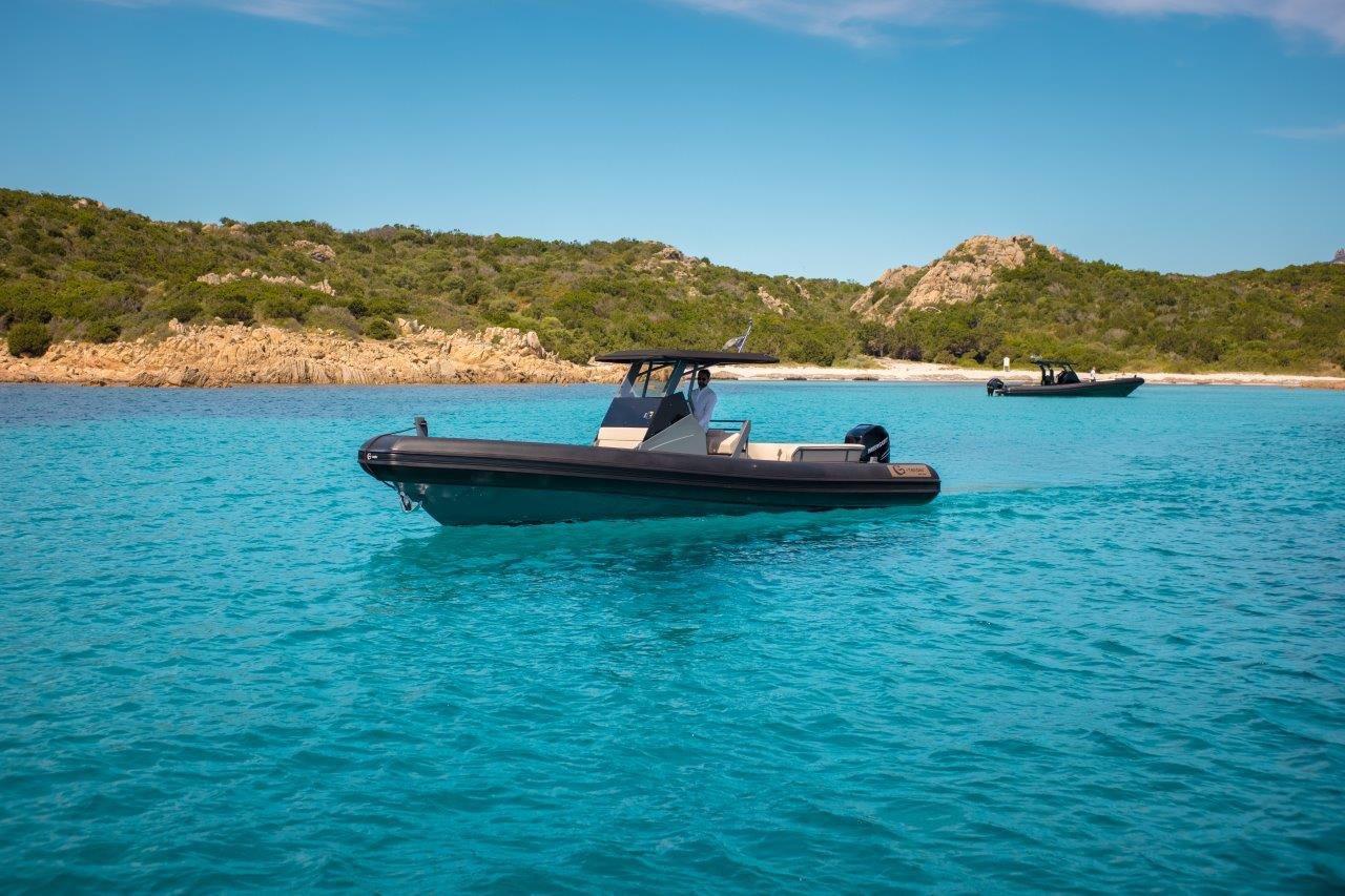 G-Tender OTTO.7 2026 G-Tender OTTO.7 boat on clear turquoise water near rocky coastline.