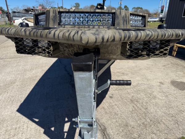 SeaArk Mud Runner 180 2025 SeaArk Mud Runner 180 boat trailer with camouflage design and LED lights.
