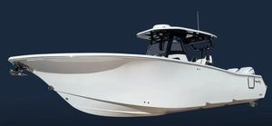 Tidewater 302 CC Adventure 2026 Tidewater 302 CC boat, sleek white design, side view on dark background.