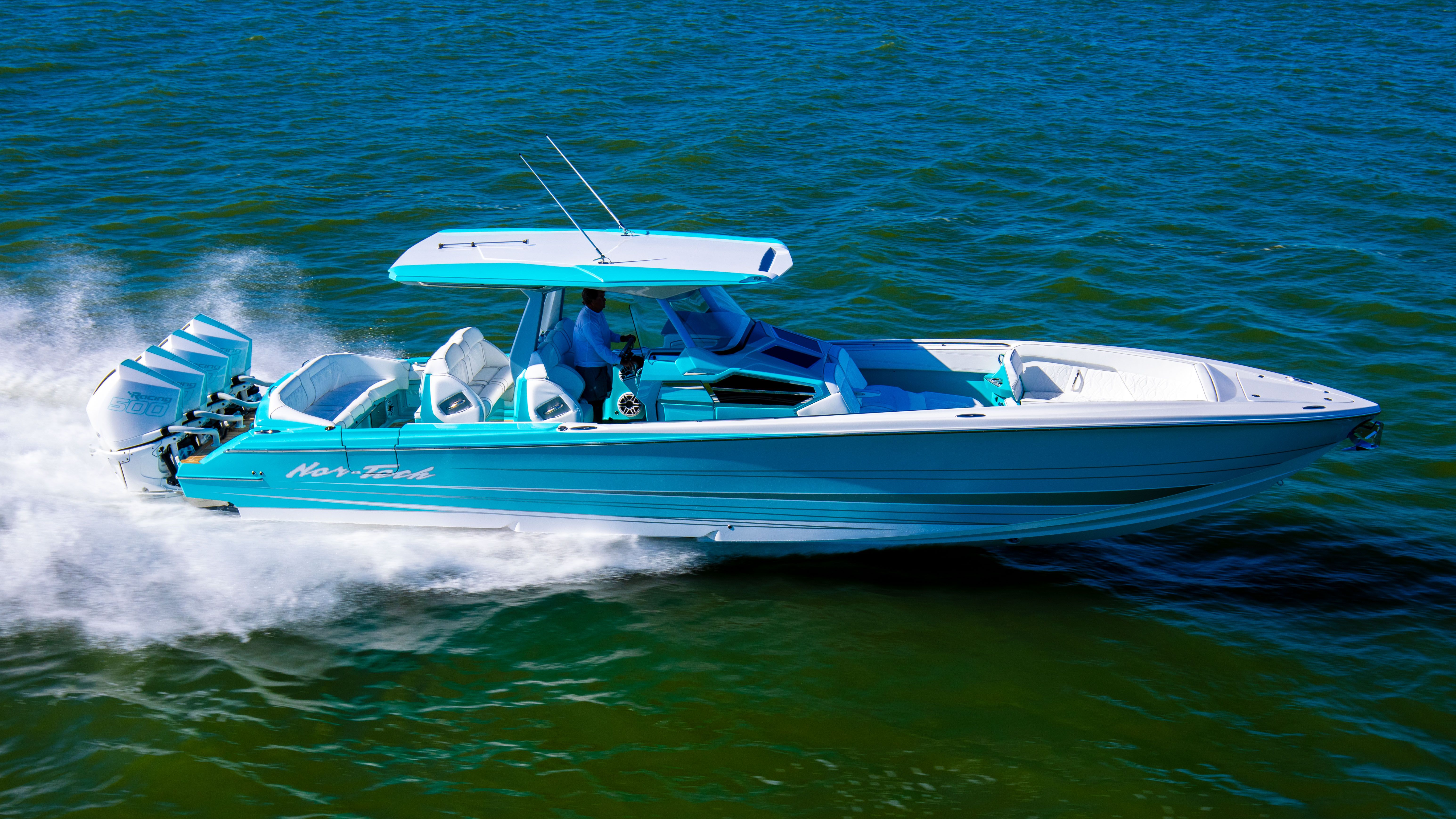Nor-Tech 400 Super Sport Center Console 2026 Nor-Tech 400 Super Sport Center Console cruising on open water, showcasing sleek design.