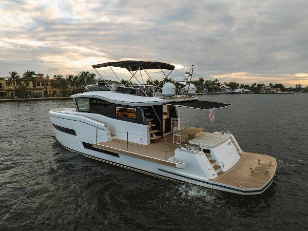 Pardo Yachts E60 2022 Pardo Yachts E60 cruising on a scenic waterway at sunset.