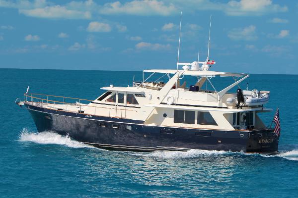 Tollycraft 61 Pilothouse Motor Yacht 1989 Tollycraft 61 Pilothouse Motor Yacht cruising on blue ocean water.