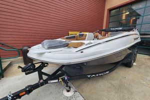 Tahoe 1950 2026 Tahoe 1950 boat on trailer, parked outside a building.