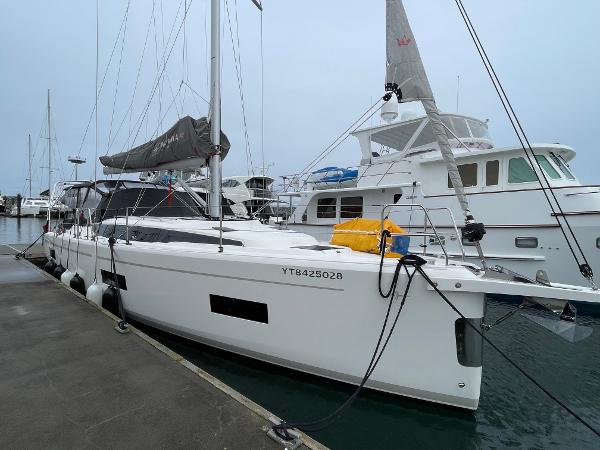 Bavaria C42 Bavaria C42 yacht, 2021 model, docked at marina with other boats in background.