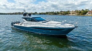 Uniesse Exuma HTC5p 2024 Uniesse Exuma HTC5p yacht on serene water, showcasing sleek design and luxury.