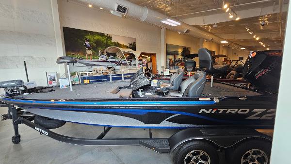 Nitro Z20 Pro 2024 Nitro Z20 Pro fishing boat displayed in a showroom.