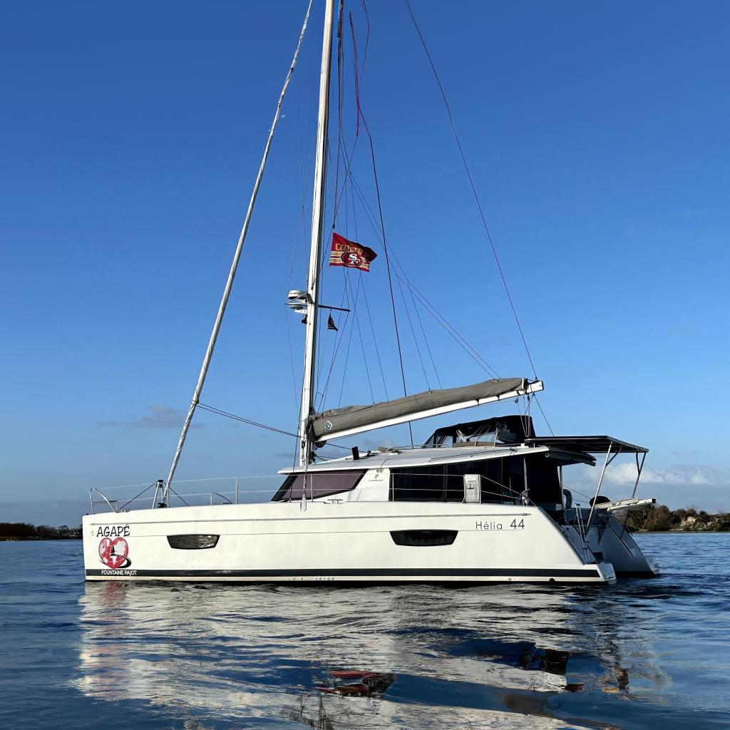 Fountaine Pajot Helia 44 Evolution 2019 Fountaine Pajot Helia 44 Evolution catamaran sailing on calm waters under clear blue sky.
