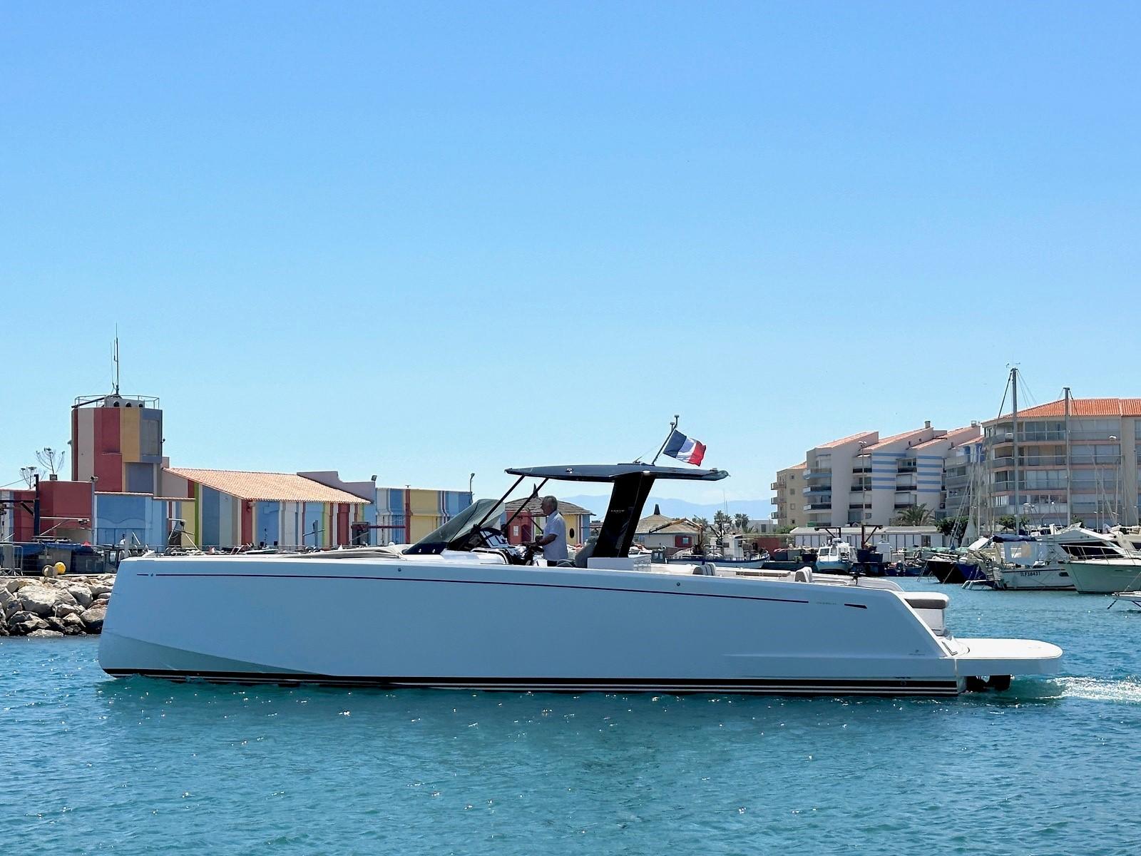 Pardo Yachts 43 2020 Pardo Yachts 43 cruising in a vibrant marina setting.