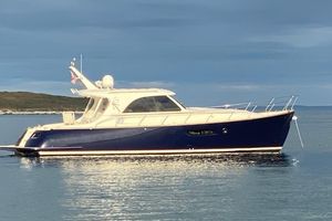 Mochi Craft 44 Dolphin 2007 Mochi Craft 44 Dolphin yacht on calm water under cloudy sky.