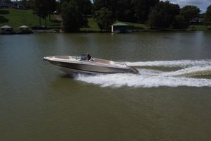 Chris-Craft Launch 30 2019 Chris-Craft Launch 30 speedboat cruising on a serene lake.