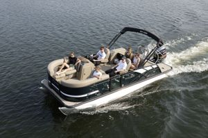 Sylvan Mirage 8520 2026 Sylvan Mirage 8520 pontoon boat cruising with passengers on a sunny day.