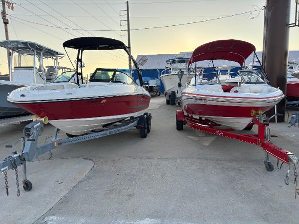 Sea Ray 205 Sport 2014 Sea Ray 205 Sport boats on trailers, parked side by side.