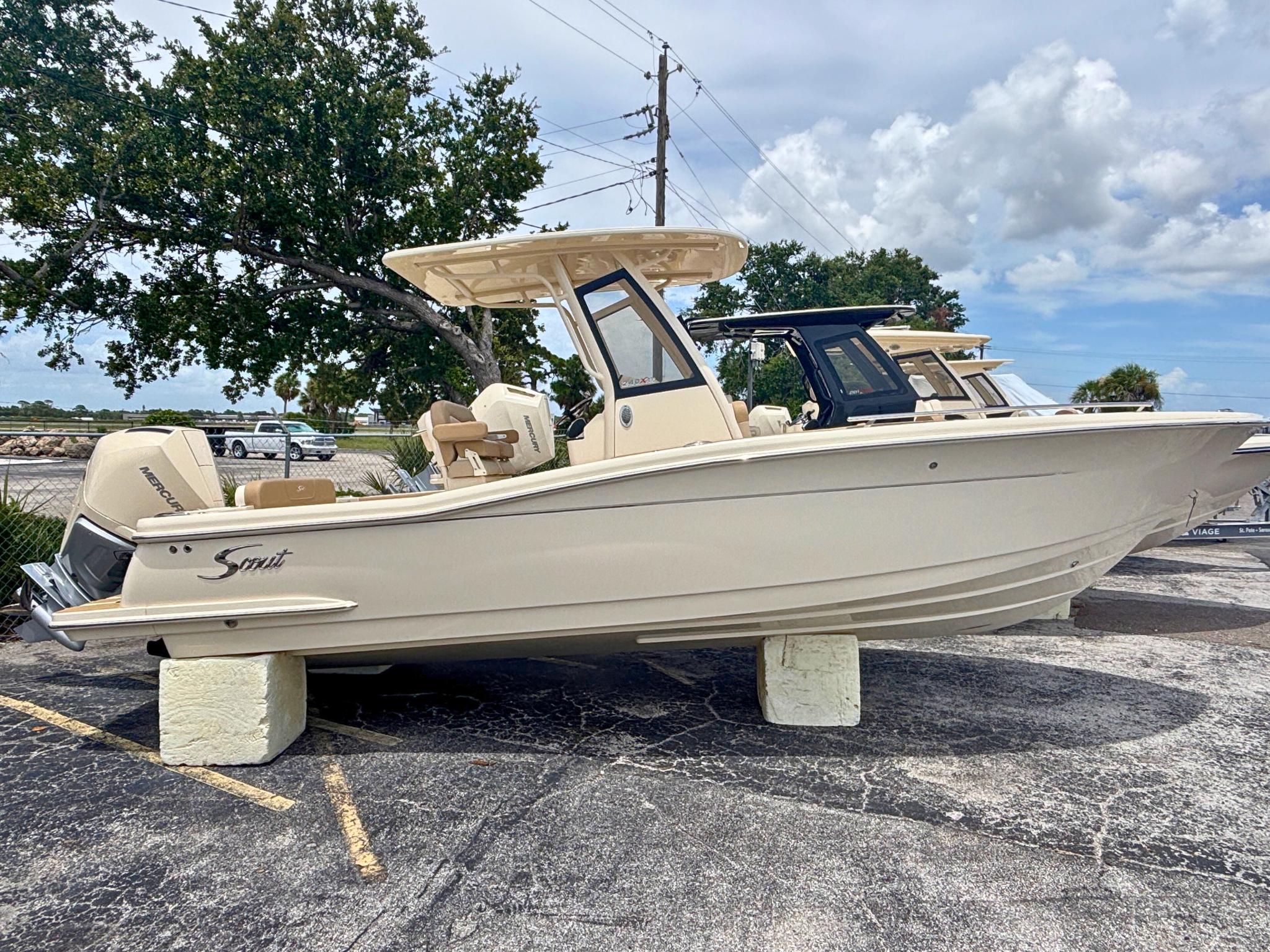 Scout 240 XSF 2025 Scout 240 XSF boat displayed outdoors on a sunny day.