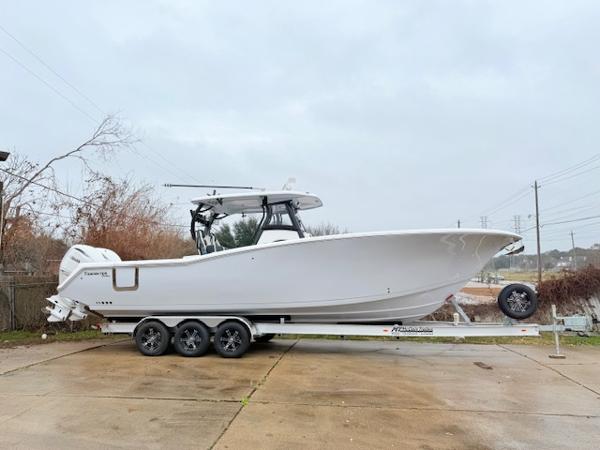 Tidewater 320 CC Adventure 2025 Tidewater 320 CC Adventure boat on a trailer, parked outdoors.