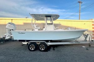 Pair Customs 24 Center Console MV 2026 Pair Customs 24 Center Console MV boat on trailer, parked outdoors.