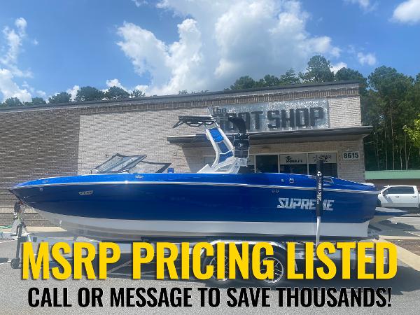 Supreme S240 2024 Supreme S240 boat displayed outside shop with MSRP pricing listed.