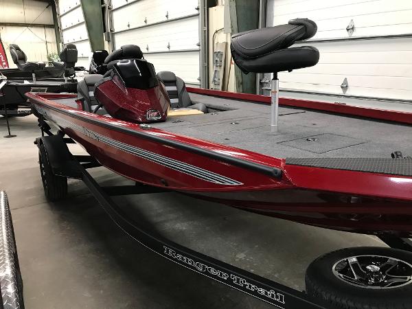 Ranger RT178C 2025 Ranger RT178C boat in showroom, featuring sleek red design and modern seating.