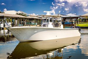 Front Runner 33 Center Console 2023 Front Runner 33 Center Console boat docked in a marina under a clear sky.