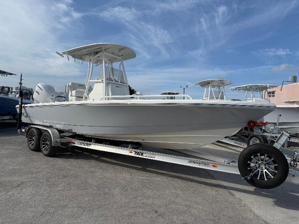 Pathfinder 2600 TRS 2025 Pathfinder 2600 TRS boat on trailer under clear blue sky.