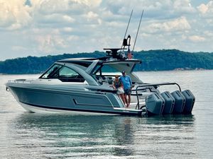Formula 400 Super Sport Crossover 2025 Formula 400 Super Sport Crossover boat on water with two people aboard.