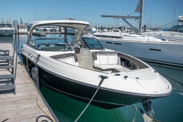 Sea Ray 350 SLX 2017 Sea Ray 350 SLX boat docked at marina, sleek design, luxury seating.