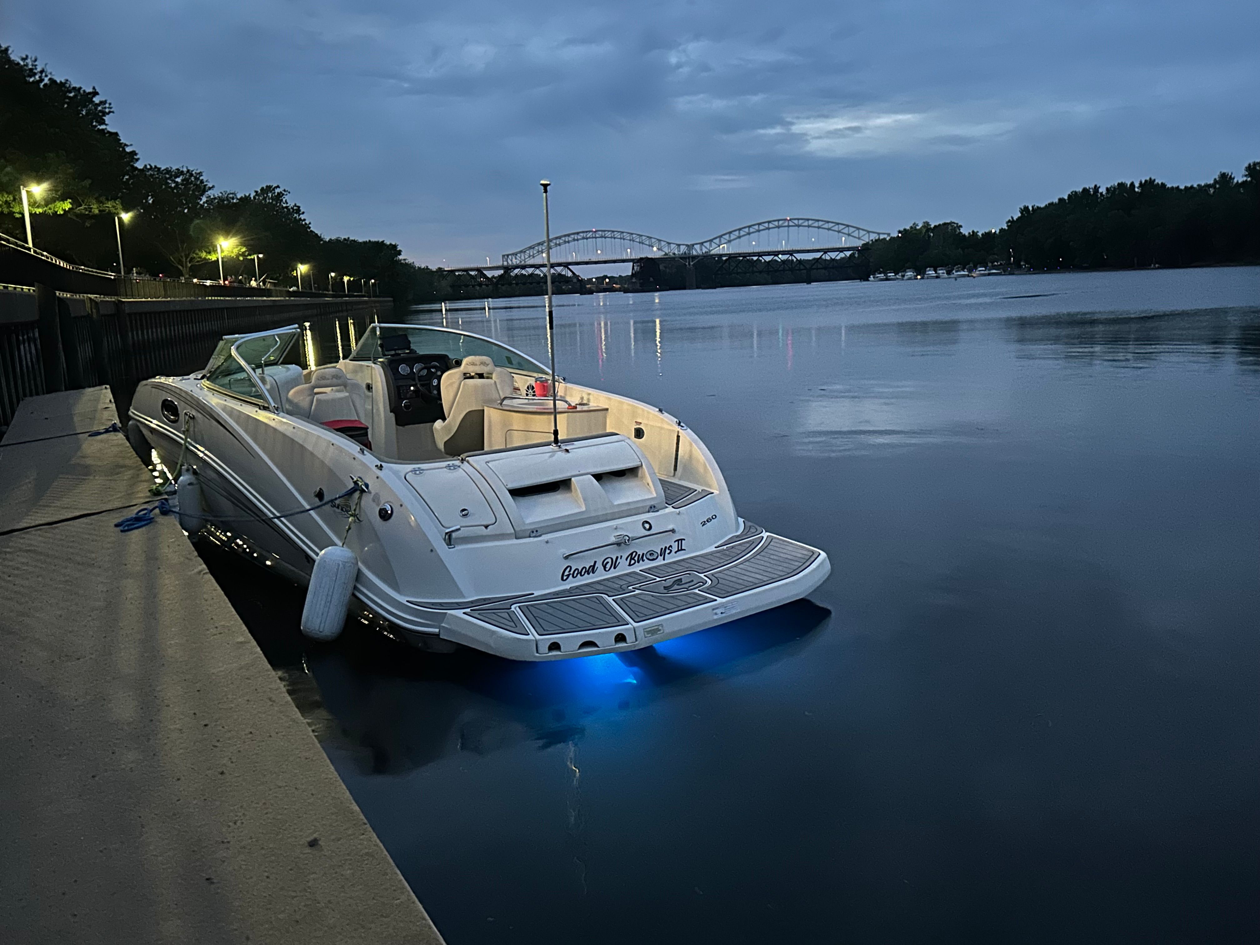 Sea Ray 260 Sundeck 2007 Sea Ray 260 Sundeck boat docked at twilight with bridge in background.