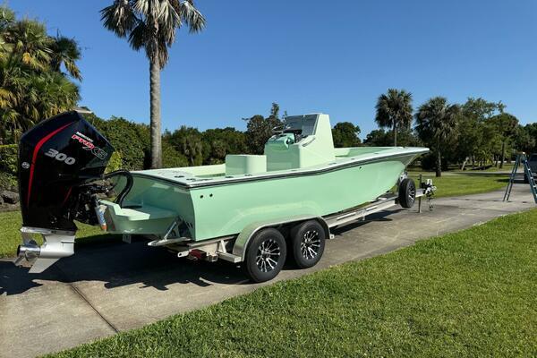 Custom Vernese V23 Custom Vernese V23 boat, 2021 model, on trailer with powerful outboard motor, parked outdoors.