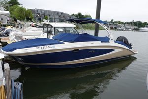 Sea Ray 270 Sundeck Outboard 2015 Sea Ray 270 Sundeck Outboard boat docked in marina.