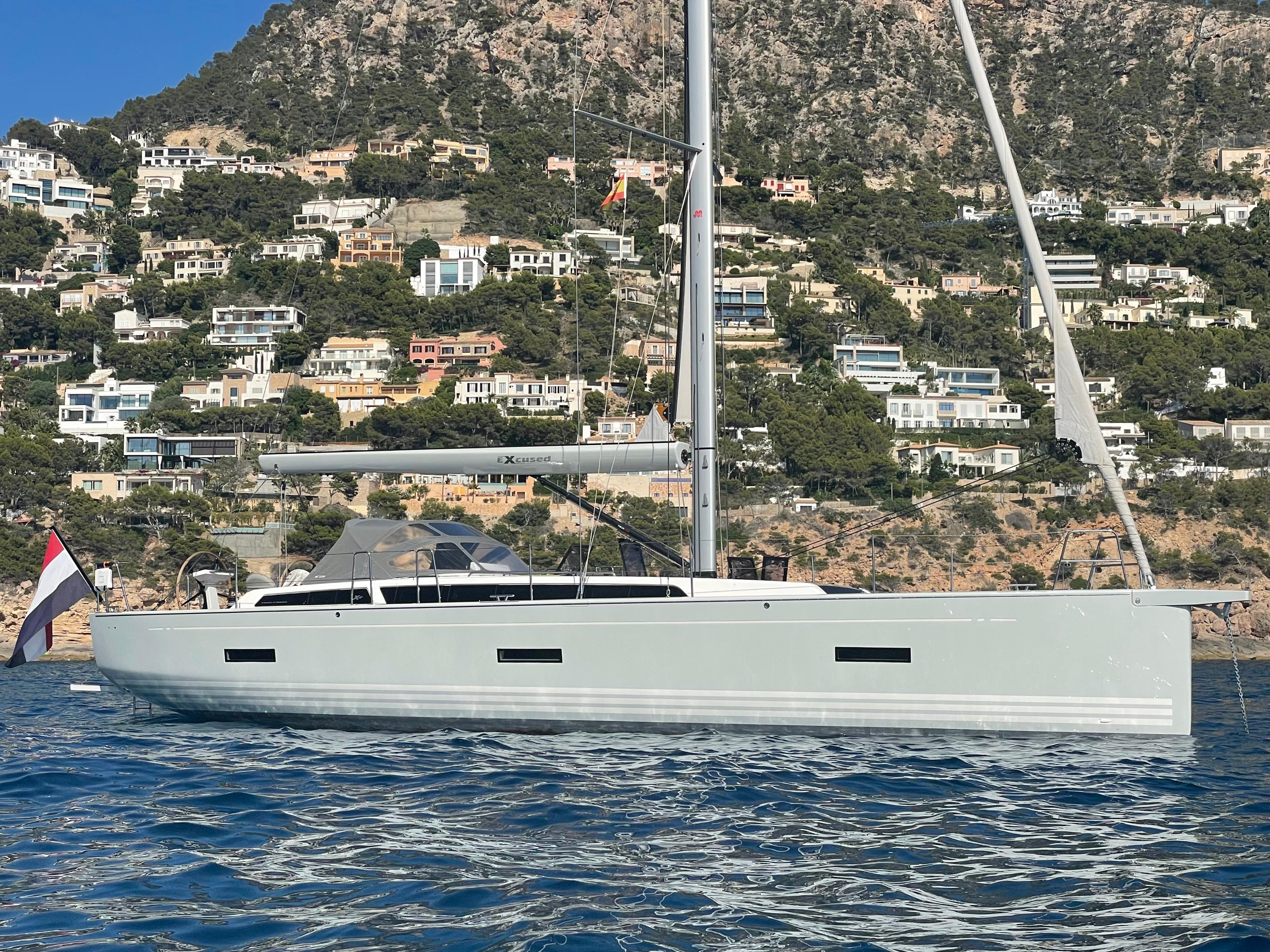X-Yachts X4.6 2019 X-Yachts X4.6 sailboat on water, scenic hillside with houses in background.