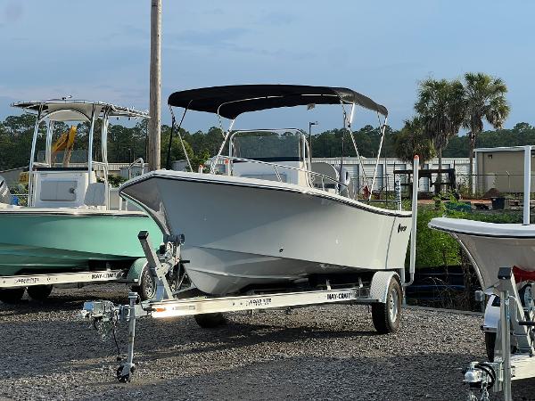 May-Craft 1900CC 2024 May-Craft 1900CC boat on trailer with canopy in outdoor lot.