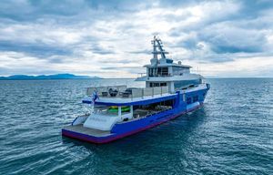 Custom Niigata Luxurious 1992 Custom Niigata yacht cruising on open sea under cloudy skies.