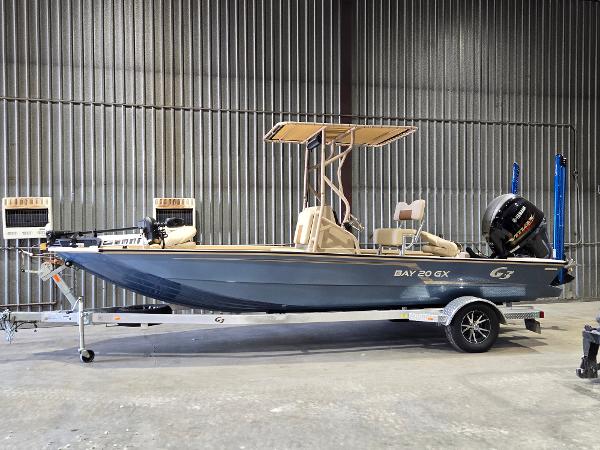 G3 Bay 20 GX 2023 G3 Bay 20 GX boat on trailer in warehouse setting.