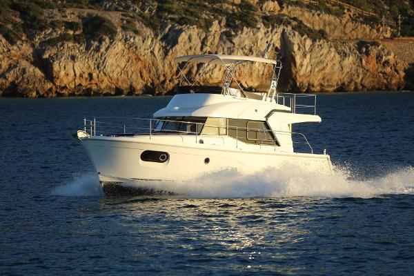 Beneteau Swift Trawler 35 2025 Beneteau Swift Trawler 35 cruising on scenic coastal waters.