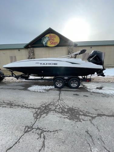 Tahoe 2150 2025 Tahoe 2150 boat on trailer outside Bass Pro Shops in winter setting.