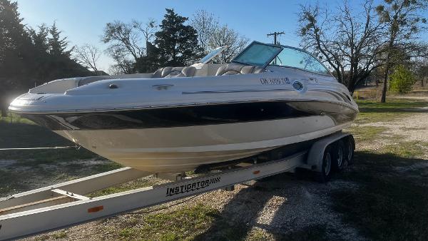 Sea Ray 270 Sundeck 2007 Sea Ray 270 Sundeck boat on trailer, parked outdoors.