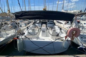 Beneteau Oceanis 34.1 2022 Beneteau Oceanis 34.1 sailboat docked in a marina, rear view.