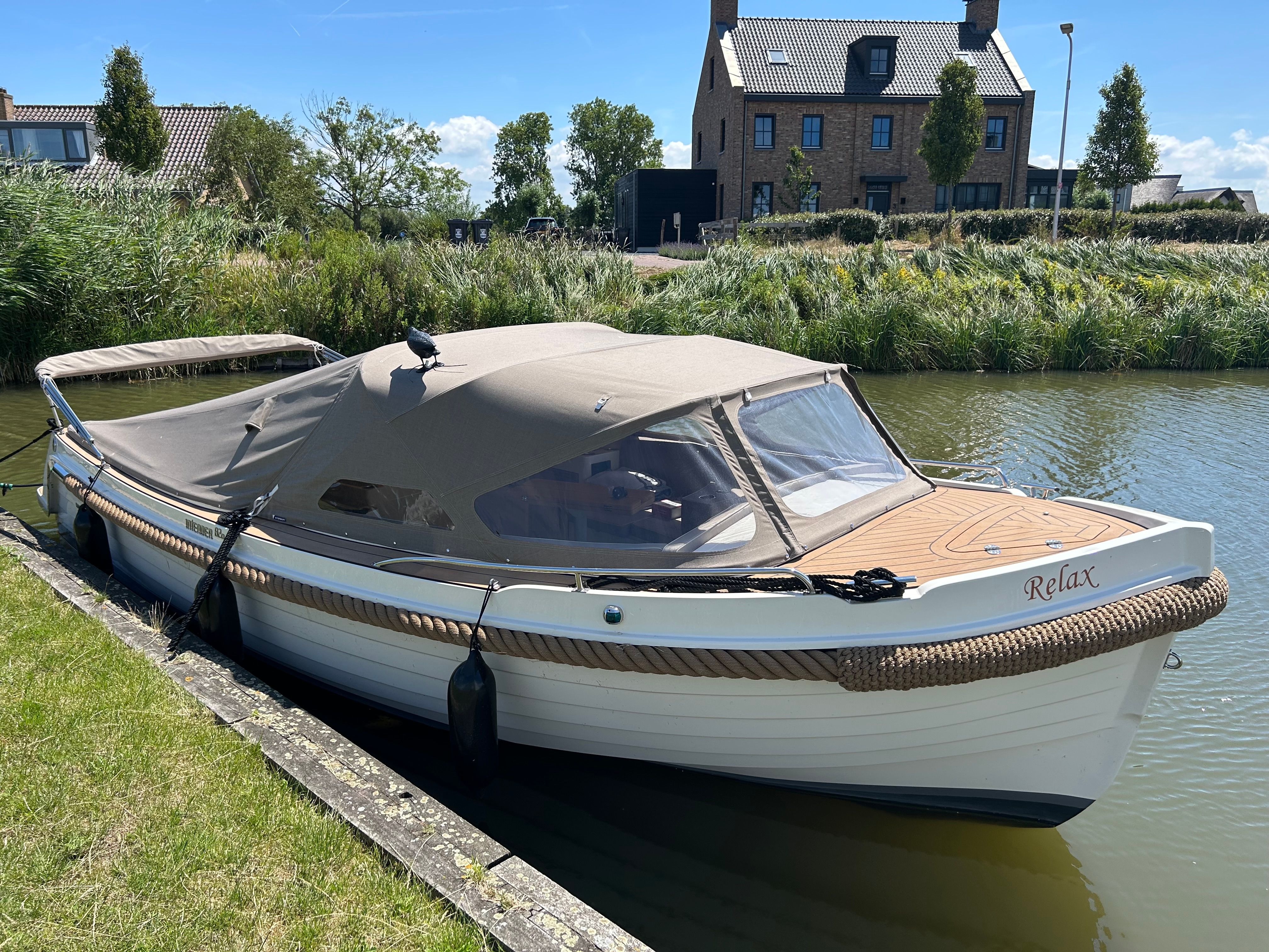 Interboat Intender 820 2024 Interboat Intender 820 moored by a canal, covered and ready for leisure.