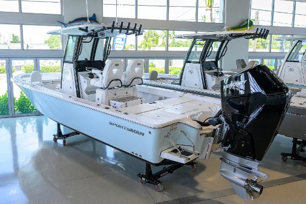 Sportsman Masters 267 Bay Boat 2025 Sportsman Masters 267 Bay Boat displayed in a showroom, featuring sleek design and powerful engine.