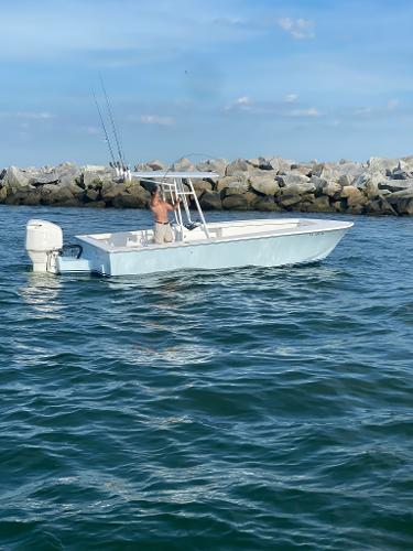 Albemarle CAPPS CUSTOM CENTER CONSOLE 2019 Albemarle CAPPS Custom Center Console boat on the water near rocky shore.