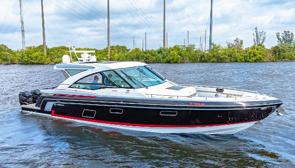 Formula 430 Super Sport Crossover 2017 Formula 430 Super Sport Crossover boat cruising on a river.